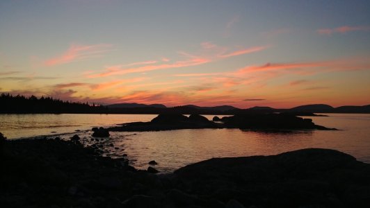 a sunset over a body of water