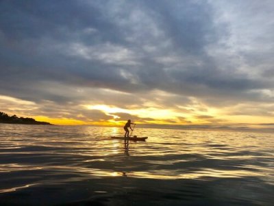 a sunset over a body of water