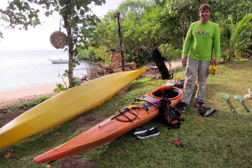 a person riding a surf board in the grass