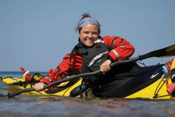 a man riding on the back of a boat