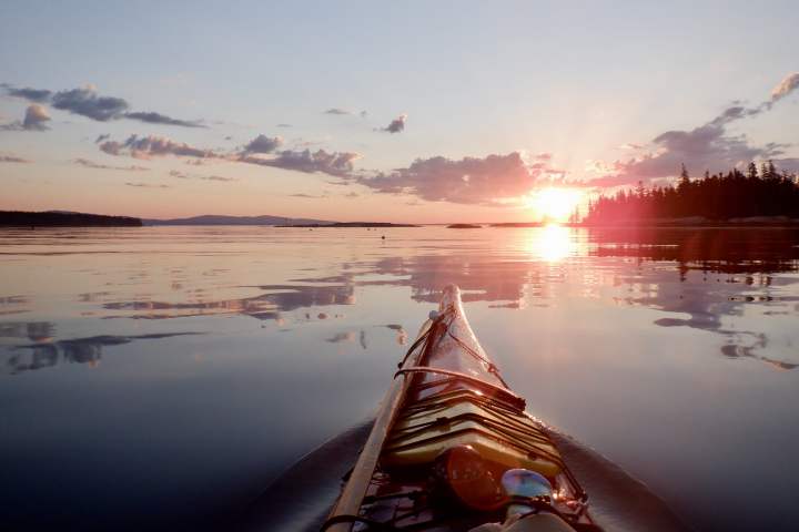 a sunset over a body of water