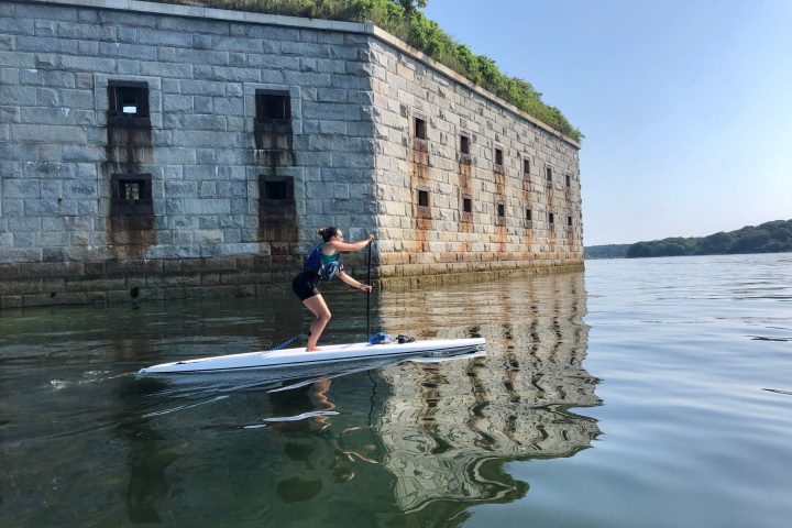 a man that is standing in the water