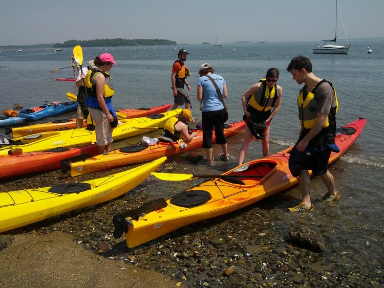 a group of people on a boat in the water