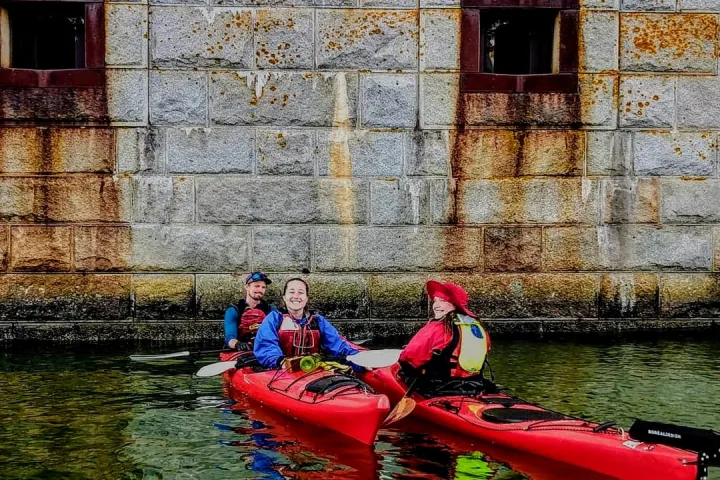 Sea kayaking alongside Fort Gorges