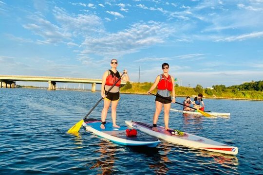 a group of people rowing a boat in the water