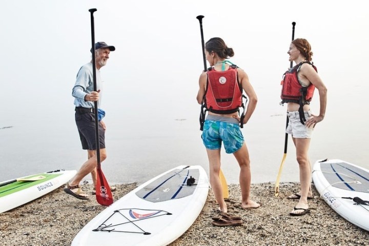 a group of people on a beach