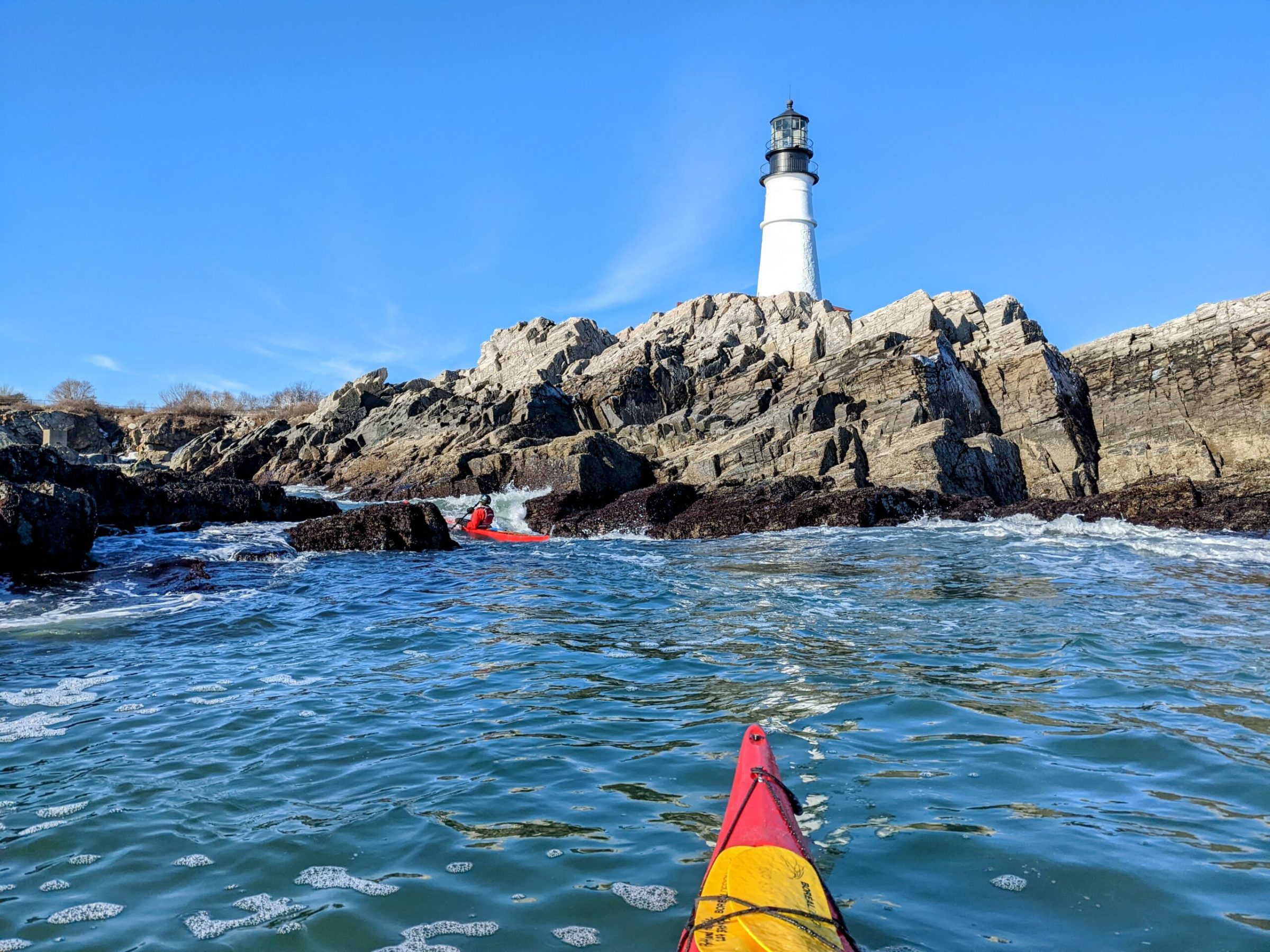 a person standing next to a body of water