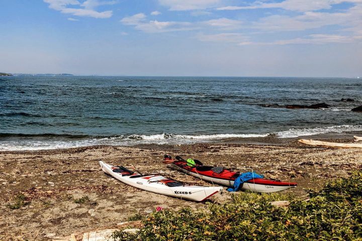 Sea kayaks on a beach