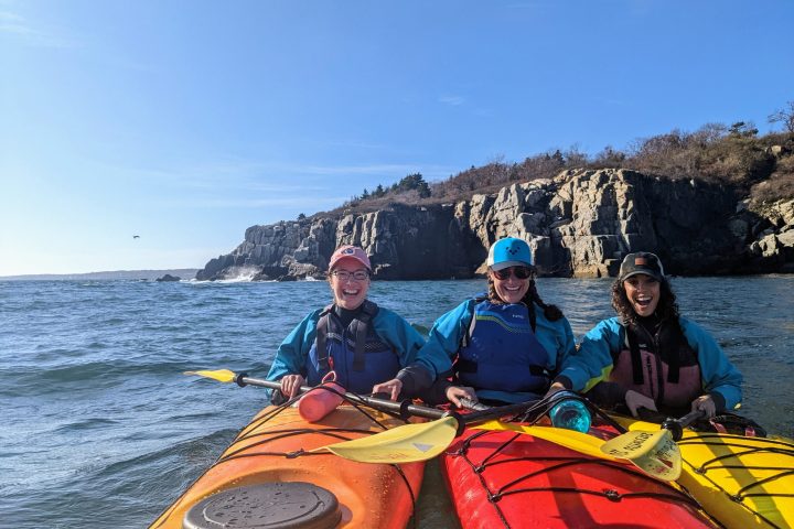 a group of people on a boat in the water