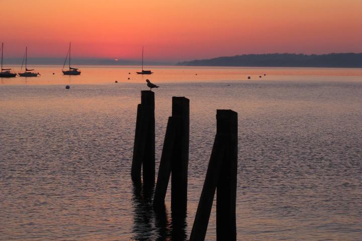 a sunset over a body of water