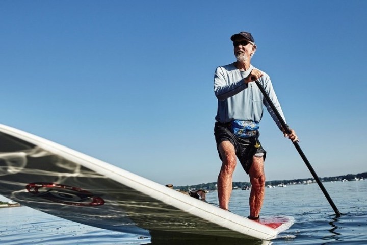a man riding on the back of a boat