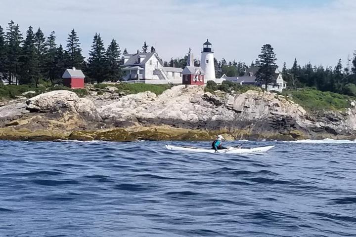 a person riding a surf board on a body of water