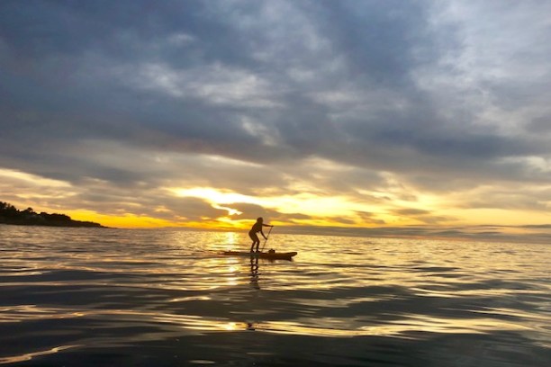 a sunset over a body of water