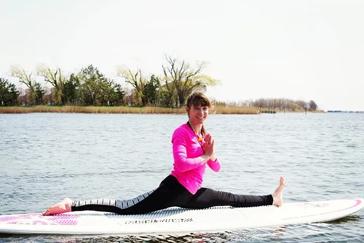 a person riding a surf board on a body of water