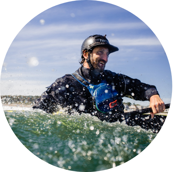 a man riding on top of a body of water