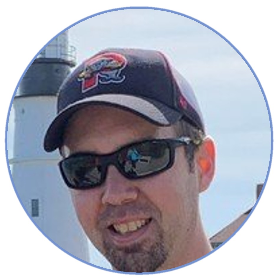 a man wearing a hat and sunglasses
