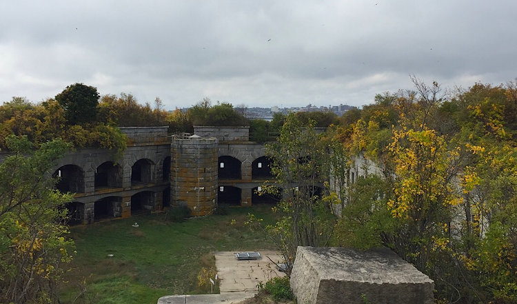 a castle on top of a grass covered field