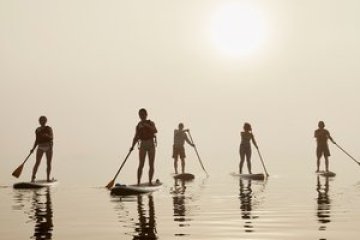 a group of people riding skis on a snowy surface