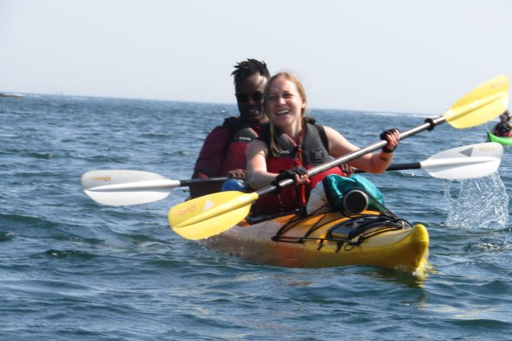 a person riding a surf board on a body of water
