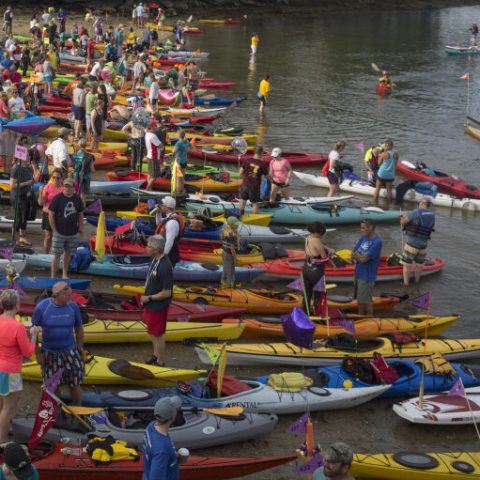 a group of people on a raft in a body of water
