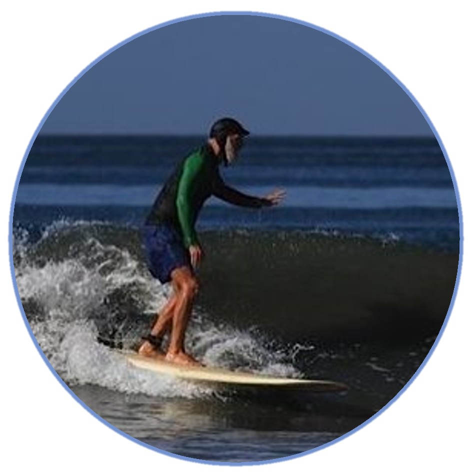 a man riding a wave on a surfboard in the water