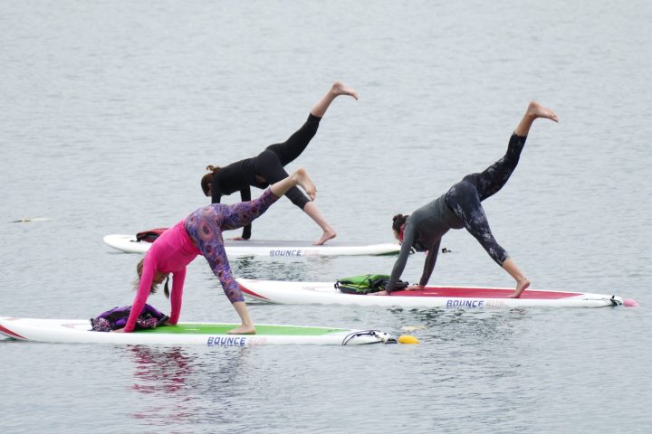 a person riding a surfboard on top of a body of water