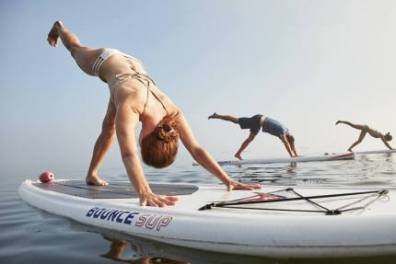 a woman riding on the back of a boat