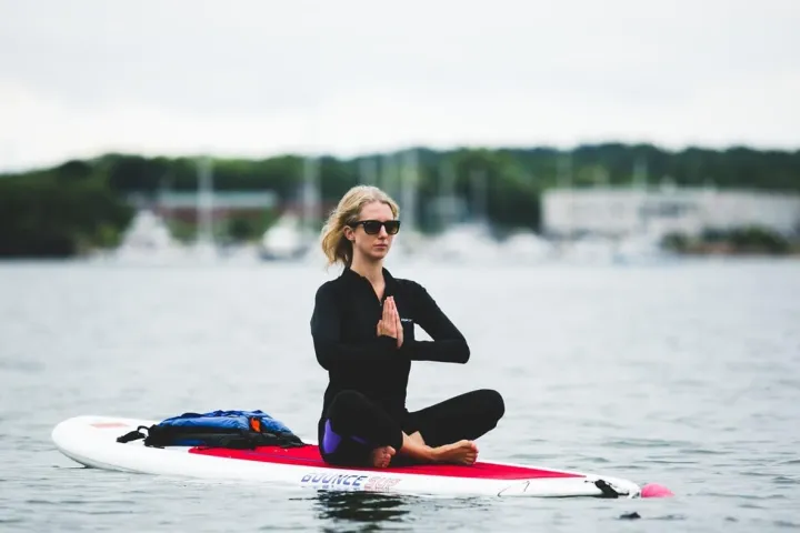 a person rowing a boat in a body of water