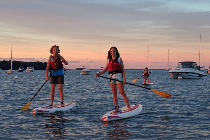 a group of people on a boat in the water