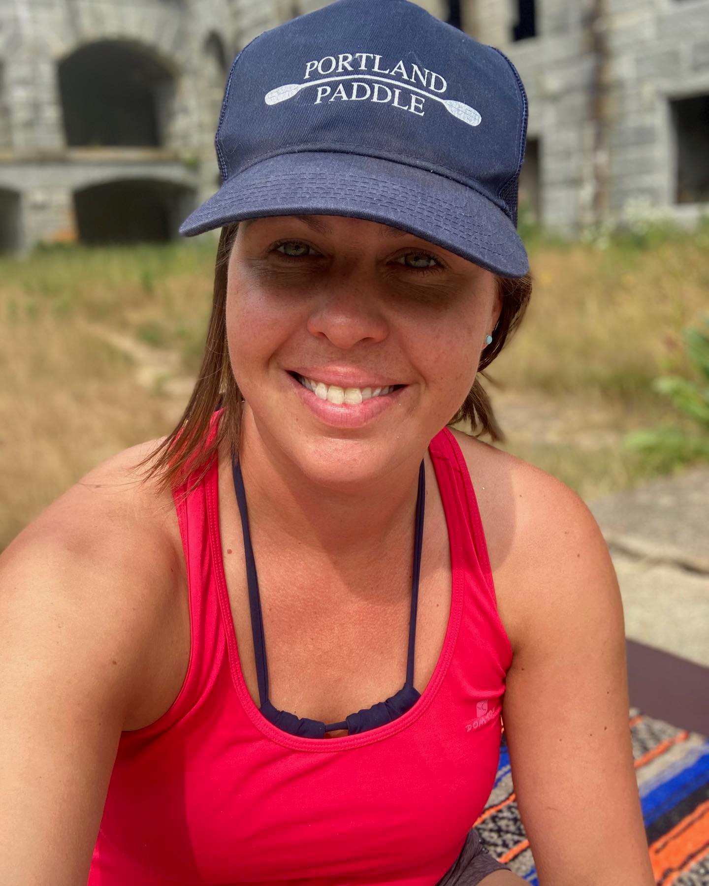 a yoga instructor smiling for the camera at Fort Gorges