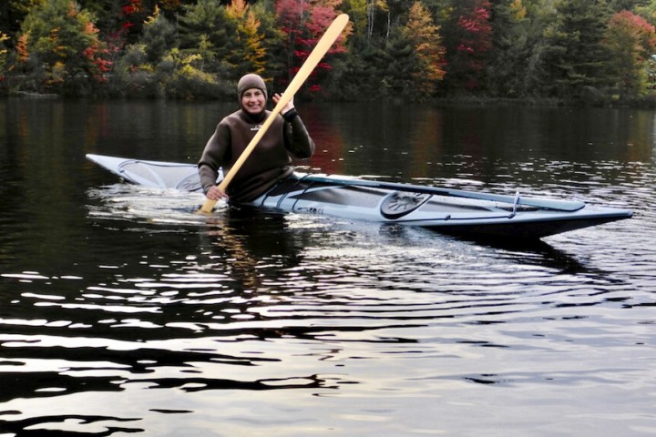 a man rowing a boat in the water