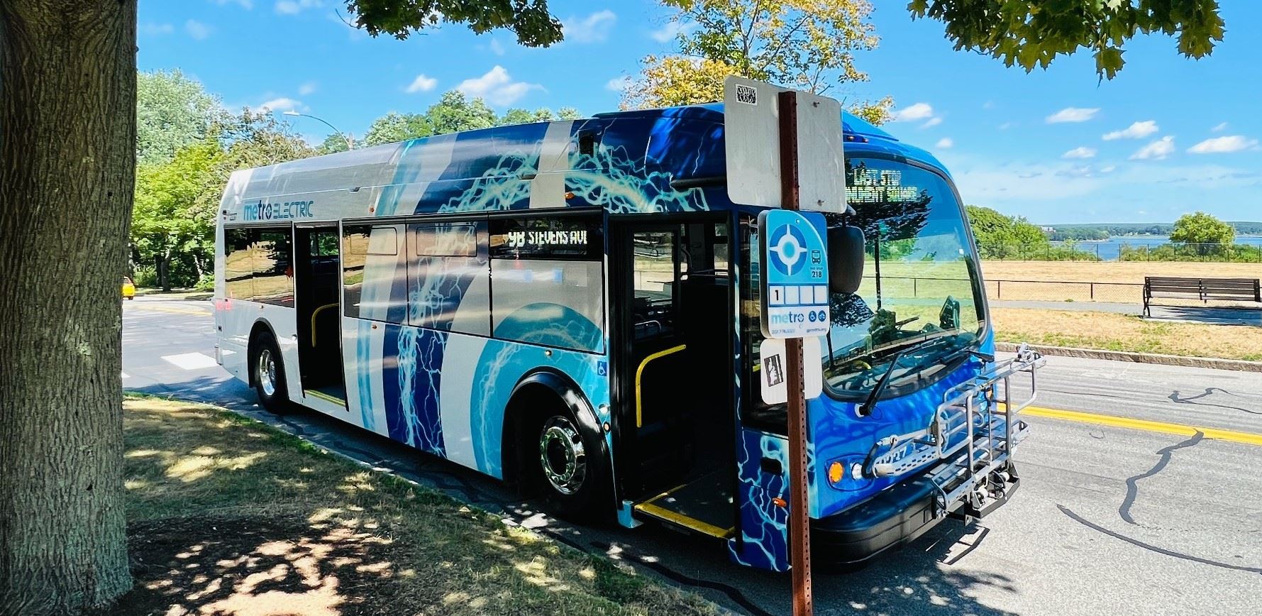 Document a bus that is parked on the side of a road