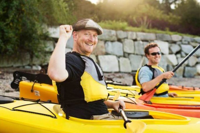 David Marshall et al. riding on the back of a boat