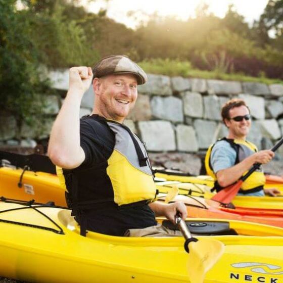 David Marshall et al. riding on the back of a boat