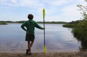 a man standing in front of Great Pond